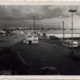 "air force base gate at Manila. Town in background Jan 15, 1955"